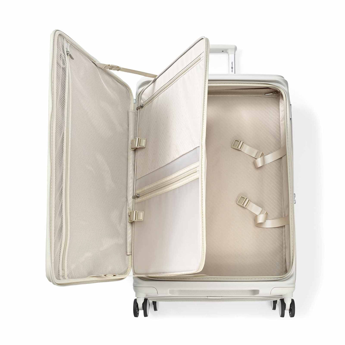 An open hard-shell spinner suitcase in a light champagne beige color, showing the interior organization with zippered pockets and compression straps, on a solid white background.