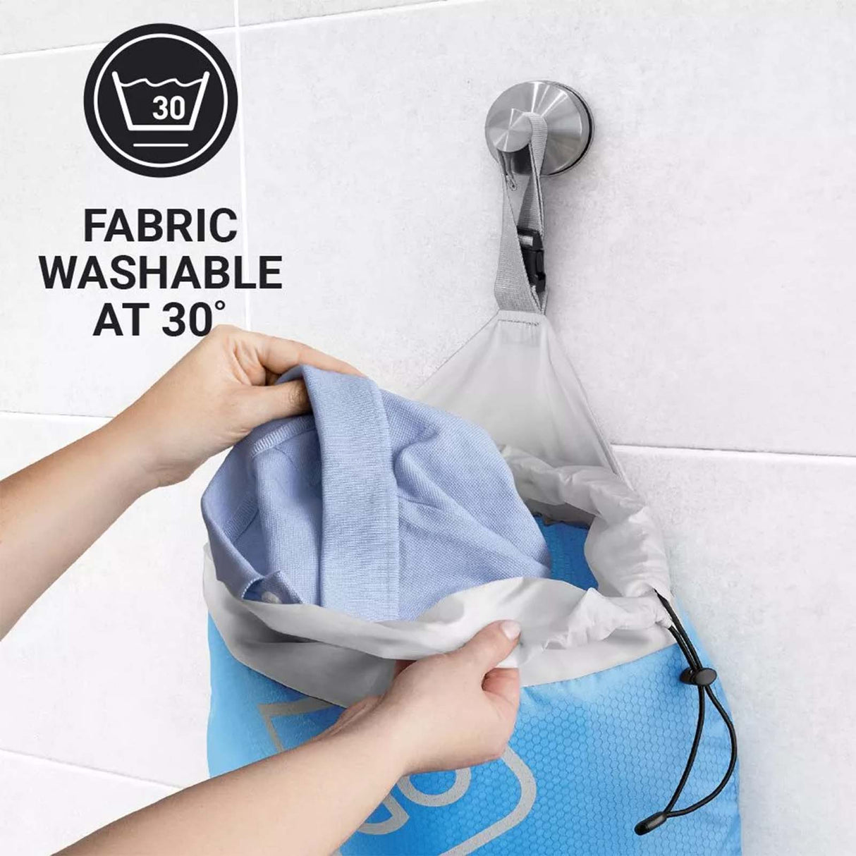 Person holding a blue fabric with a white drawstring bag, showing fabric washable at 30 degrees.