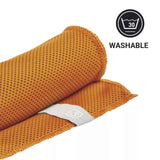 Orange towel with a visible brand logo on a white background, featuring a washable icon.