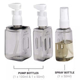 Three bottles with pump and spray mechanisms on a white background