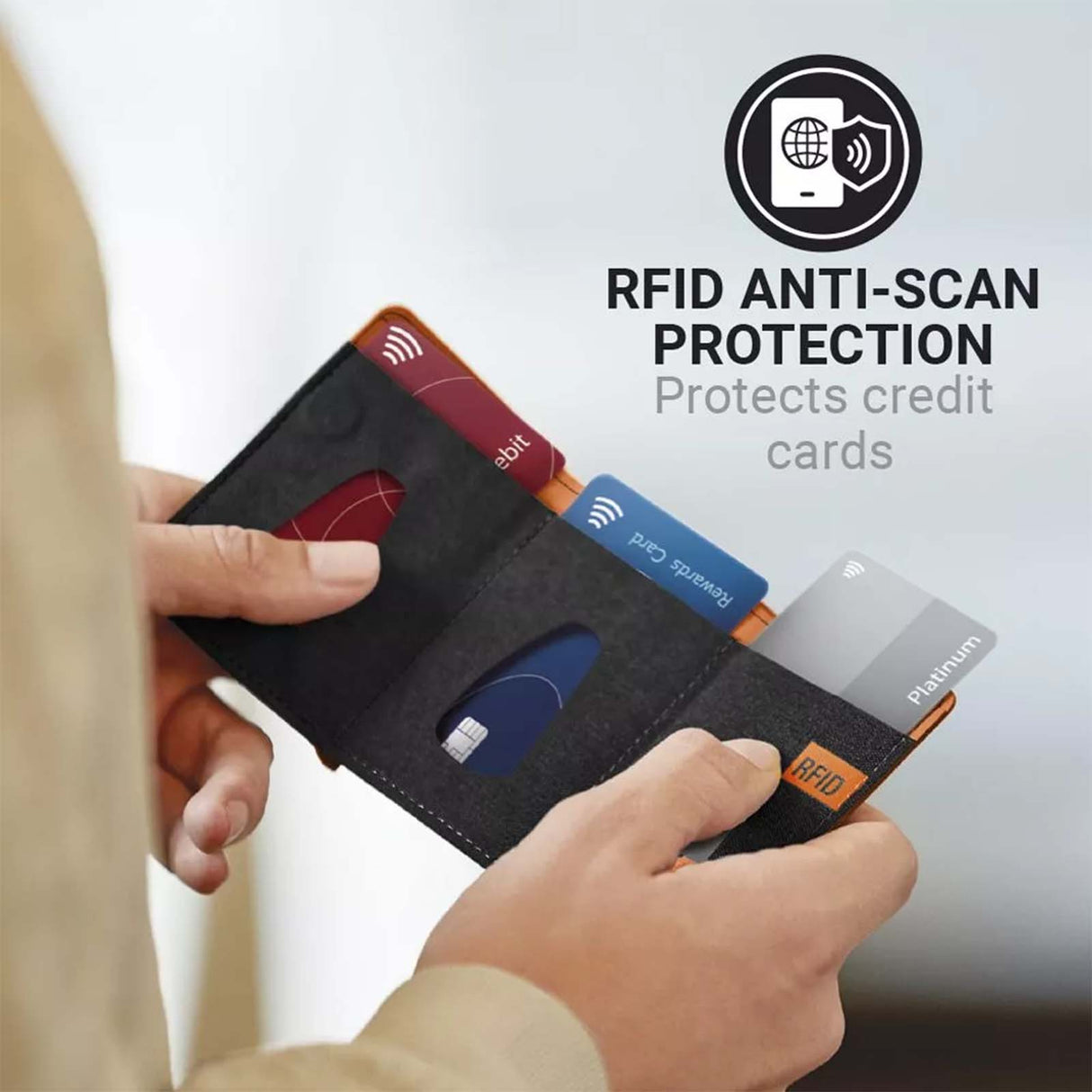 Person holding a wallet with credit cards, emphasizing RFID anti-scan protection.