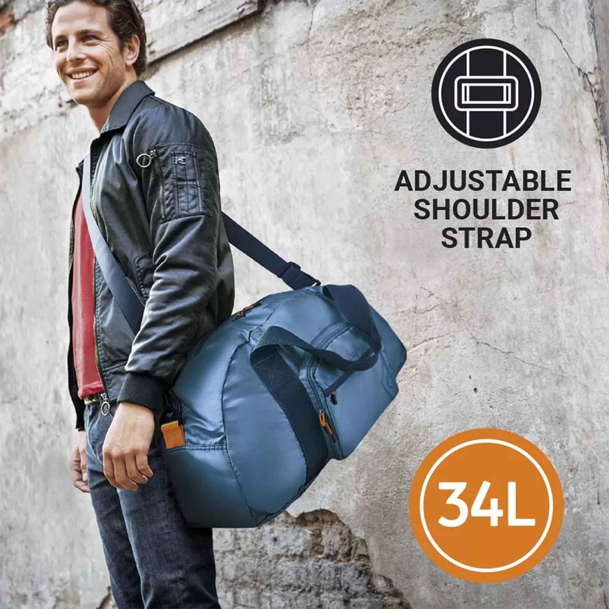 Man holding a blue duffel bag with an adjustable shoulder strap and 34L capacity label on a textured wall background.