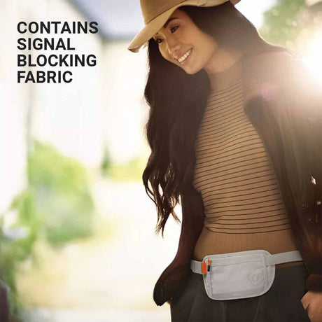 Woman wearing a brown top with text about signal blocking fabric, outdoors.