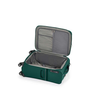 Green Samsonite suitcase with open lid on a white background