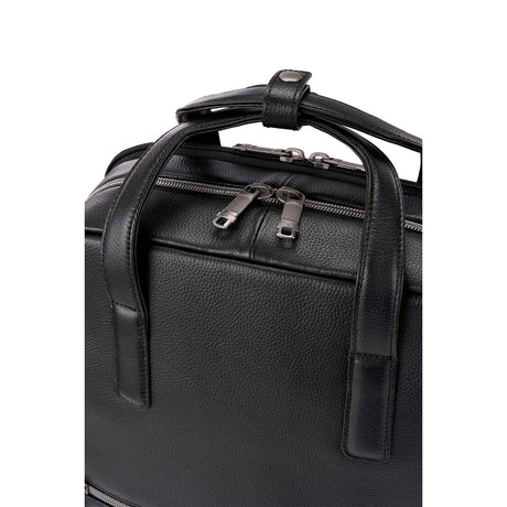 Close-up of a black pebbled leather bag with dual top handles, zipper closures, and silver-toned hardware on a plain white background.