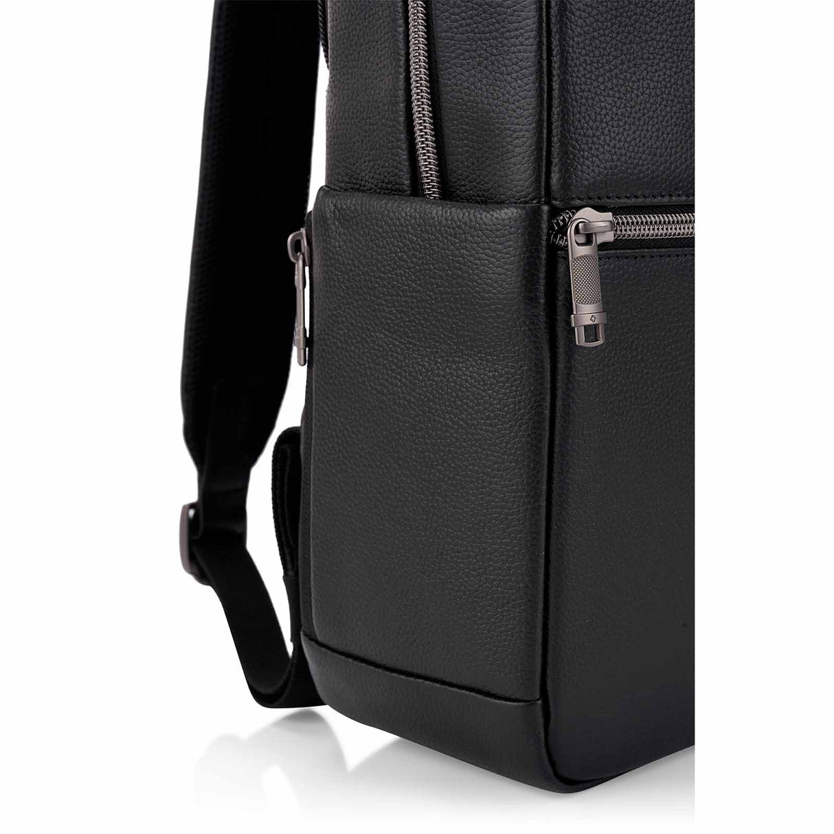 Close-up of a black pebbled leather backpack or messenger bag showing the side pocket, front zipper, and strap on a white background.