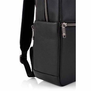 Close-up of a black pebbled leather backpack or messenger bag showing the side pocket, front zipper, and strap on a white background.