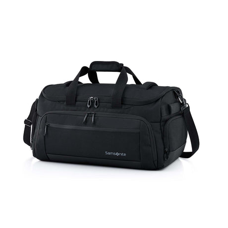 A black Samsonite duffel bag with multiple zippered pockets, top carry handles, and a detachable shoulder strap, photographed on a clean white background.