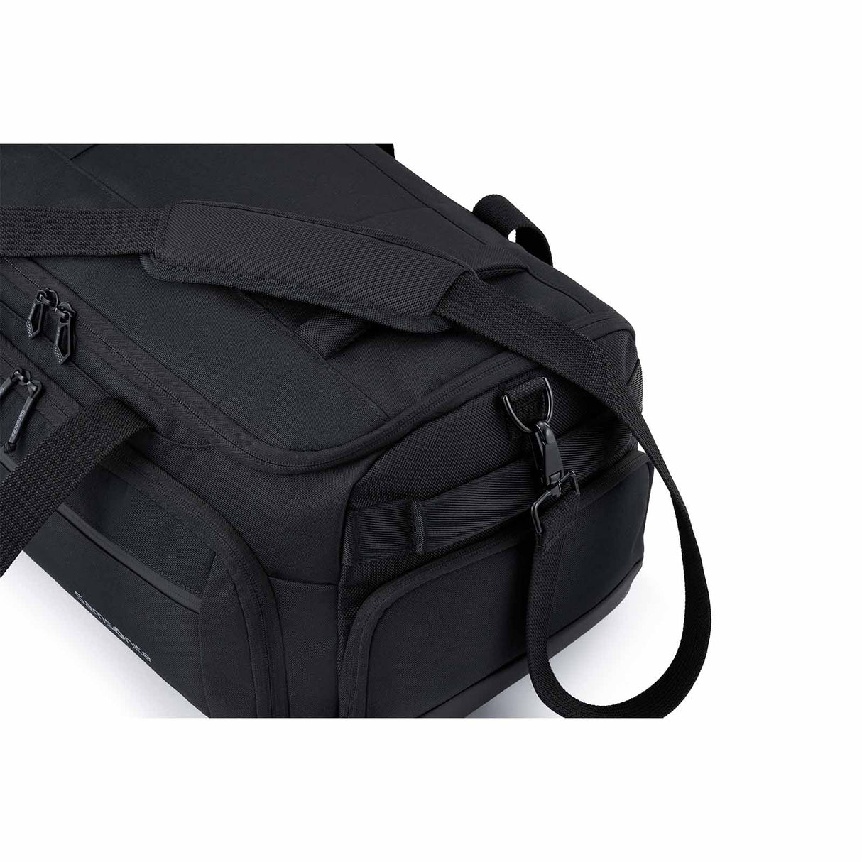 A black duffel bag with multiple zippered compartments and adjustable shoulder straps, shown on a plain white background.