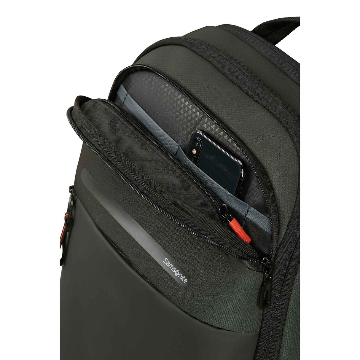 Close-up of a dark Green Samsonite backpack showing an open front zip pocket with a smartphone inside, on a white background.