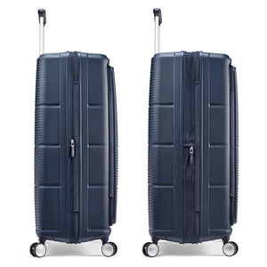 Two navy blue hard-shell spinner suitcases shown side by side on a clean white background.