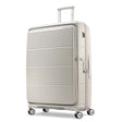 A cream-colored hardshell spinner suitcase with a ribbed front panel, shown on a clean white background.