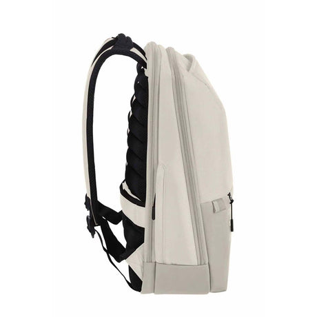 A light beige backpack shown from a side profile view, featuring black padded shoulder straps and a black side pocket, set against a plain white background.