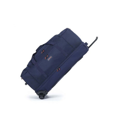 A navy blue rolling duffel bag with an extended telescoping handle, shown at an angle on a clean white background.