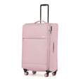 A light pink softside spinner suitcase with an extended black telescoping handle, shown on a plain white background.