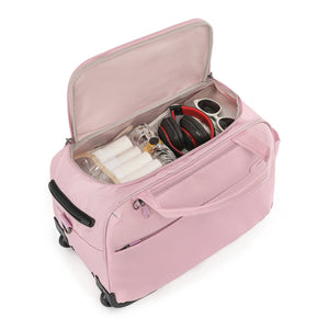 A light pink rolling Carry-On bag opened, shown from a top angle on a clean white background.